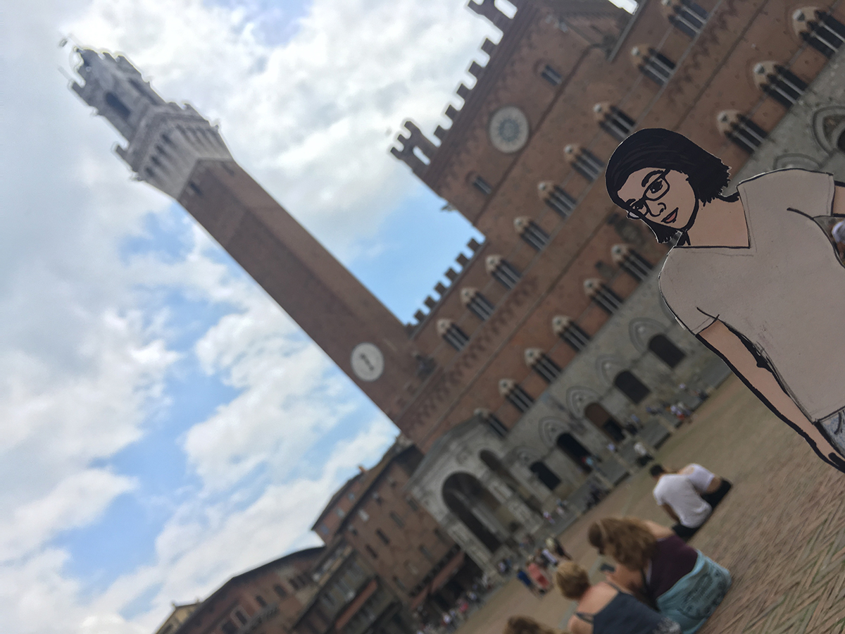 paper doll of the artist in main square in Siena, Italy